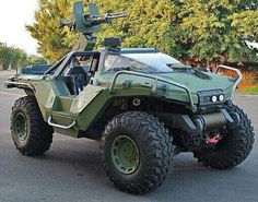 an army vehicle is parked on the street