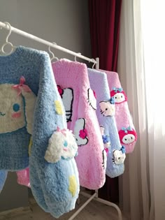 hello kitty towels hanging on a clothes rack