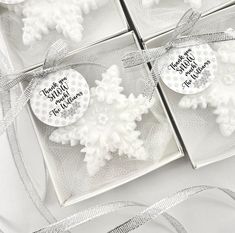 three snowflakes are in a box with ribbons and tags that say thank you for the season