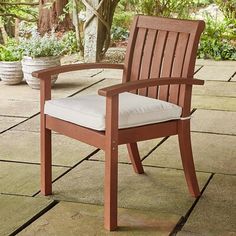 a wooden chair sitting on top of a patio