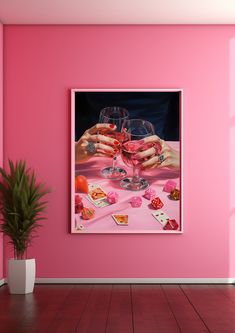 a pink room with two hands holding wine glasses