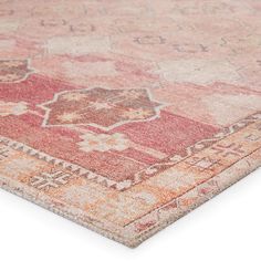 an orange and pink rug on a white surface with no one in it or someone else