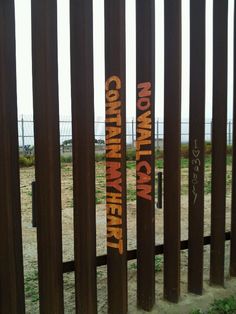 some writing on the side of a fence