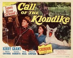 a movie poster for the film call of the klondike with two people and a dog