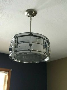 a drum kit is hanging from the ceiling