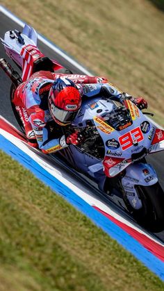 a person riding a motorcycle on a race track