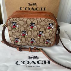 Signature Jacquard Mickey Mouse Color: Brown Embroidered Mickey Mouse Dimensions; 17cm L X 13cm H X 5.5cm W Non-Removable Shoulder Strap In Good Condition, No Damage With Dust Bag Disney Coach Bags, Coach Disney Bags, Crossbody Bag Disney, Coach Disney Tote, Disney Handbags Kohl's, Coach Disney, Mouse Color, Coach New York, Coach Bags