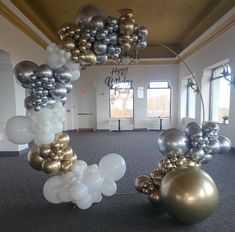 an arrangement of balloons in the middle of a room