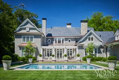 a large house with a pool in the front yard