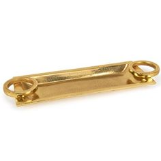 a gold plated metal object with two handles and an open loop on the end