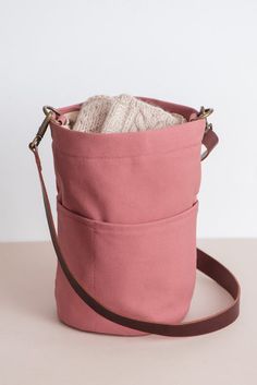 a small pink bag sitting on top of a table