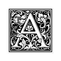 an ornamental letter in black and white