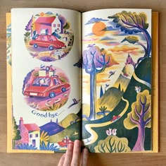 an open children's book with pictures of cars and houses