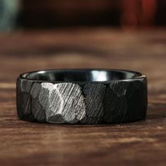 Introducing The Apollo Noir - a bold and captivating men's black titanium wedding band that draws inspiration from the enigmatic depths of space. Handcrafted with precision and care, The Apollo Noir showcases the striking and mysterious allure of black titanium, making this ring the perfect choice for the man who desires a contemporary and distinctive style ring built for durability.
Embrace the dark side of the cosmos with The Apollo Noir, a wedding band that combines the durability of titanium Titanium Rings For Men Wedding Bands, Groom Wedding Band Black, Mens Wedding Bands Aesthetic, Obsidian Ring Mens Wedding Bands, Men’s Textured Wedding Band, Viking Mens Wedding Bands, Black Hammered Wedding Band, Black Titanium Wedding Band, Wedding Ring Men Black