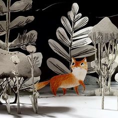 an orange and white cat standing in the snow next to some trees with leaves on them