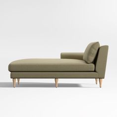 a beige chaise lounger with wooden legs on an isolated white background, front view