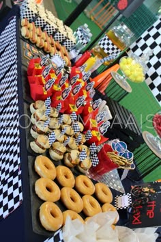 a table topped with lots of donuts and candy