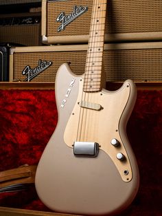 an electric guitar sitting on top of a case