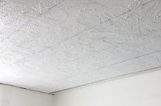 the ceiling is painted white and has blue lines on it