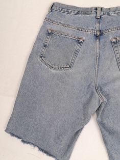 "Vintage 90's retro Calvin Klein Jeans denim shorts, they have been cropped. Zipper and button fly. Very good vintage condition, a couple of faded marks and over-all fade, perfect for a relaxed 90's look. They would fit waist 33\" - 34\". Size tag reads 34. Please read the measurements below very carefully and compare to one of your own garments, to avoid any disappointment regarding the fit. Item is measured flat: - waist: 42 cm; - front rise: 32 cm ; - length (waist to hem): 58 cm. All our ite Faded Rigid Denim Bottoms For Summer, Washed Blue Rigid Denim Summer Bottoms, Washed Blue Rigid Denim Bottoms For Summer, Summer Washed Blue Rigid Denim Bottoms, Retro Straight Leg Shorts With Pockets, Vintage Wide Leg Bottoms With Frayed Hem, Vintage Wide-leg Bottoms With Frayed Hem, Retro Cutoff Jean Shorts For Streetwear, Vintage Straight Leg Cotton Shorts