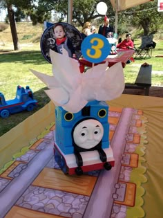 a thomas the train birthday cake on a table