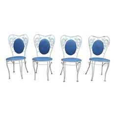 four chairs with blue upholstered back and seat cushions on white metal frame, set of 4