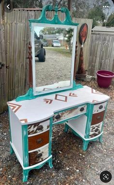 an old vanity with a mirror on it