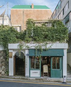 an old building with ivy growing on it's side