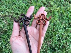 Note: The actual color might be slightly different due to lights and/or quality of a camera. Since this is a handmade item and every wood has different grain and color, you might get an item with slightly different wood grain and color as pictured. But they are all unique and beautiful. This beautiful hair stick  is hand carved and  made from 100% Rosewood and saba wood. It could also be used as a shawl/scarf pin Please choose  from drop down menu the material that you would like to purchase: Ro Celtic Snake, Wood Hair Pin, Snake Wood, Pin Hair, Hair Fork, Scarf Pin, Hair Stick, Shawl Scarf, Reddish Brown