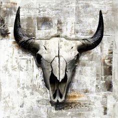 a bull's skull mounted to the side of a wall