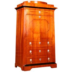 a wooden cabinet with drawers and knobs on the doors is isolated against a white background