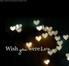 the words wish you were here are lit up in the dark with hearts on it