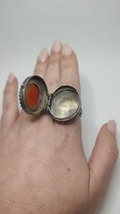 Impressive antique arabic islamic gemstone carnelian and sterling pill snuff box ring. A true statement piece locket ring set with a large carved carnelian set to the front. In good condition with time patina It is Unmarked and tests as 800 silver, c1910s. Weight 20 grams Inside diameter  18 mm  All of our pieces are in pre-loved, vintage or antique condition, with signs of age and wear preserved as a mark of authenticity. Large Gemstone Rings, Antique Silver Openable Jewelry, Locket Ring, Victorian Ring, Carnelian Agate, Sterling Silver Locket, Silver Locket, Box Ring, Victorian Rings