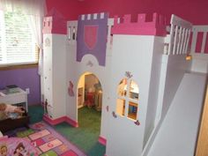 a child's bedroom with a princess castle bed in the corner and pink walls