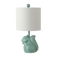 a green squirrel lamp with a white shade