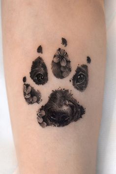 a dog's paw print on the left arm with flowers coming out of it