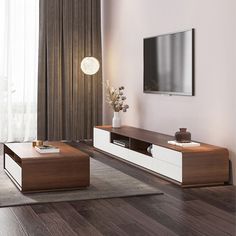 a living room with wood flooring and white furniture in front of a flat screen tv mounted on the wall