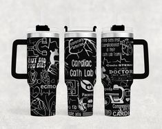 three black and white travel mugs with different types of writing on the side, one is