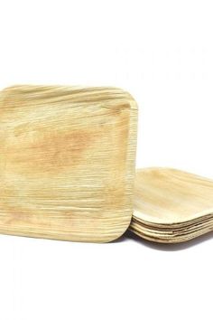 four wooden plates stacked on top of each other