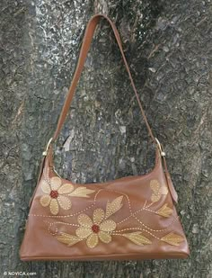 Artisans from the Mãos da Prata Association combine warm brown and tan for this charming shoulder #bag. Embroidered Brown Hobo Shoulder Bag, Brown Embroidered Hobo Shoulder Bag, Embroidered Brown Tote Hobo Bag, Embroidered Brown Hobo Tote Bag, Embroidered Brown Hobo Bag, Embroidered Brown Crossbody Shoulder Bag, Brown Embroidered Crossbody Shoulder Bag, Brown Embroidered Shoulder Bag, Brown Embroidered Satchel For Travel