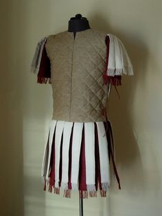 a dress made out of fabric with fringes on it