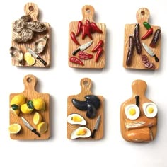 four wooden cutting boards with different types of food on them