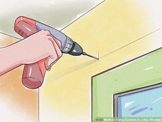 a person using a power drill to fix a hole in the wall with a screwdriver