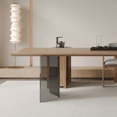 a wooden table sitting on top of a white carpeted floor next to a chair