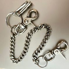 "Beefy lobster claw clasp  with double filed metal chain wallet chain  The heavy curb chain 3/8\" wide is in two lengths- 11/5\" as shown in photo, total length 17\" or 9.5\", total length 15\".   Heavy duty lobster claw clasp to attach to wallet or belt loop Sturdy 1 1/2\" removable keyring for keys.  Two extra hooks for more keys. Secures your keys while easy to get to in your pocket. Made by us in the USA since 1994. (Wallet Not included) Your wallet chain will come wrapped for a safe journey to you. Any questions, just ask!  Thank you!" Jean Wallet, Waist Jewellery, Chain Outfit, Trucker Wallet, Waist Jewelry, Unique Wallets, Safe Journey, Chain Wallet, Wallet Chain