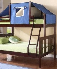 a bunk bed with a blue tent on the top and green pillows below, in a room