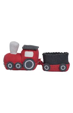 a red toy train with a black engine