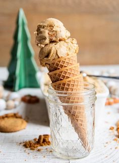 an ice cream cone is in a glass jar