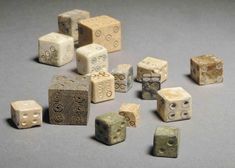 several different sized and shaped dices on a table