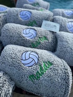 volleyball balls are lined up on display for sale